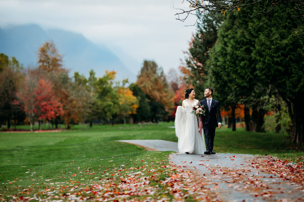 fun and easy going couples portrait with fall leaves at golden eagle golf club wedding in pitt meadows